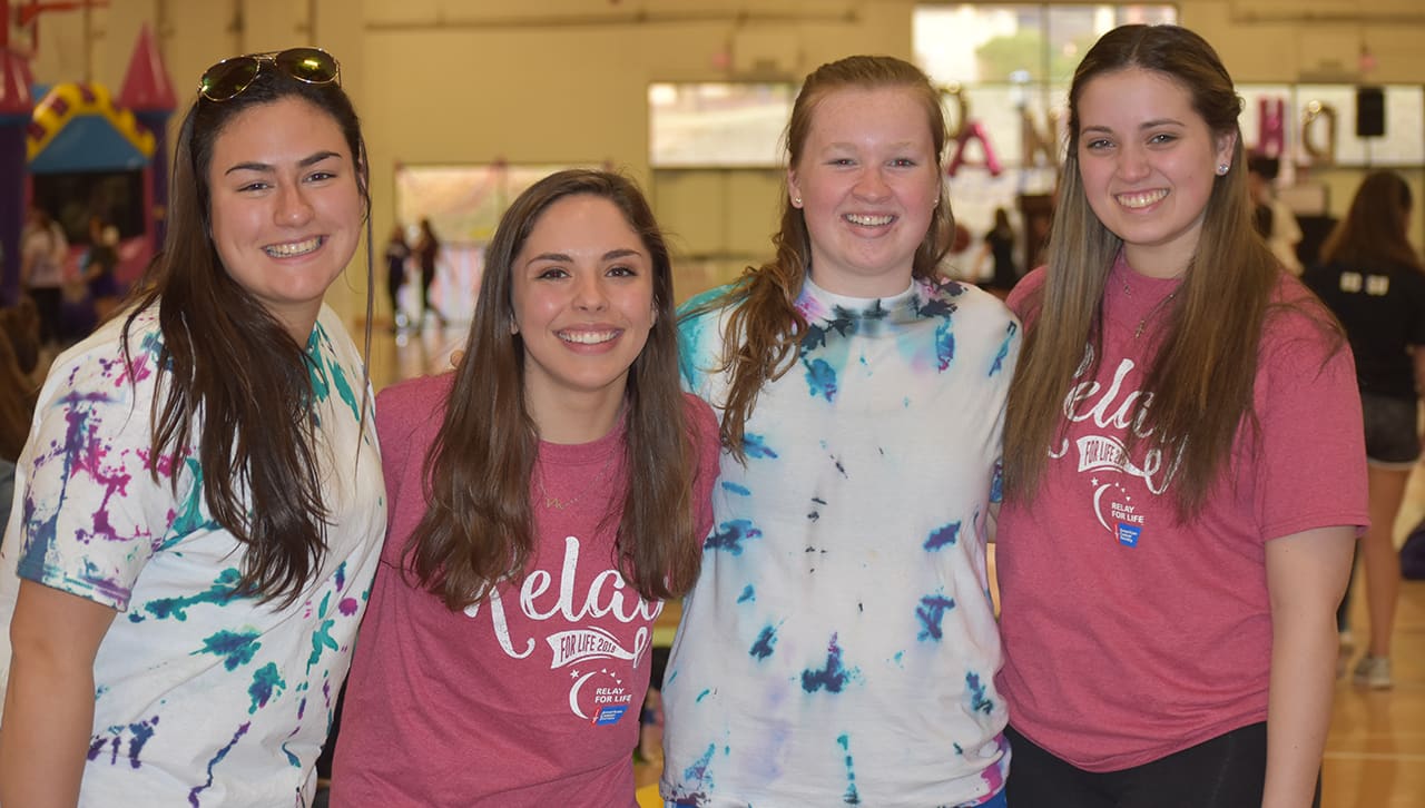 From left, Kathleen Kelly '20, Courtney Tampone '20, Caelyn McGowan '20 and Nicole Rutman '20 participate in Relay for Life at the Byron Center.